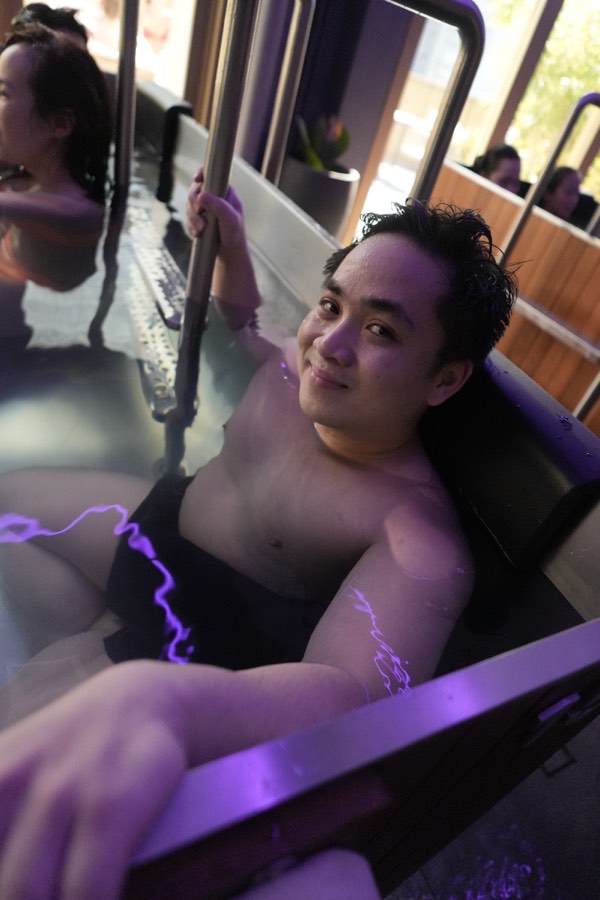 Guest smiling in the cold plunge