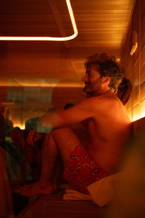 Guest smiling in the sauna